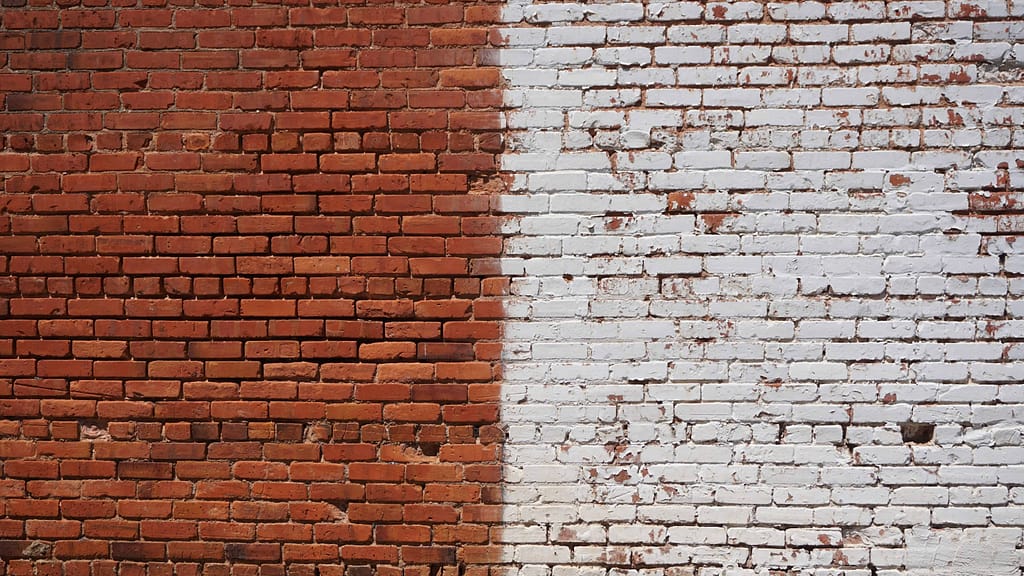 two sides of a brick wall: red and white
